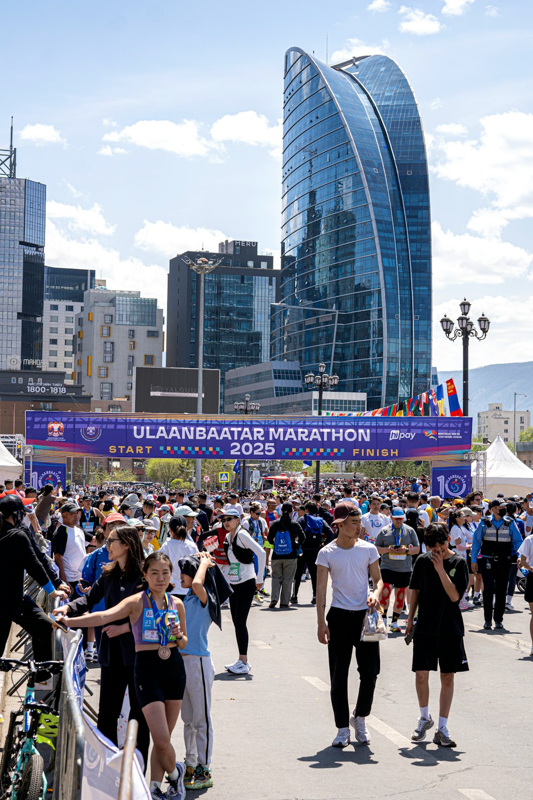 Crowds and participants gather at a city marathon in Ulaanbaatar marathn 2025, celebrating community, sport, and outdoor activity.