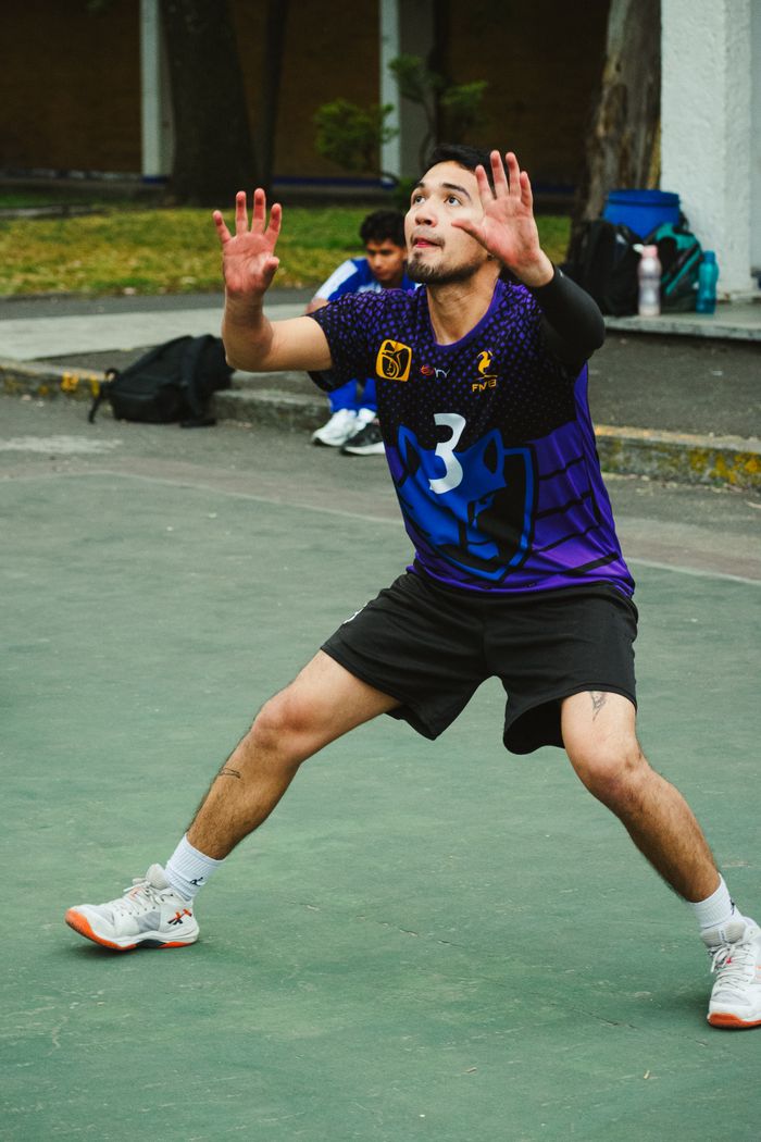 about-me-02 A young male volleyball player getting ready to serve during an outdoor match in Ciudad de México.